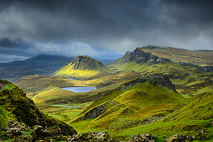 aerial photography of mountain surrounded with green grass beneath with clouds, quiraing HD wallpaper
