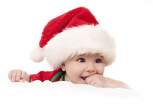 baby wearing santa hat
