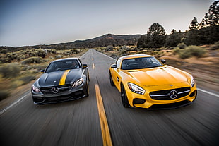 two yellow and black Mercedes-Benz sports cars