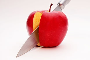 sliced red  Apple with gray knife HD wallpaper