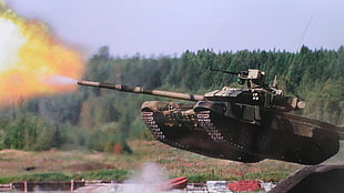 grey and black battle tank firing during daytime
