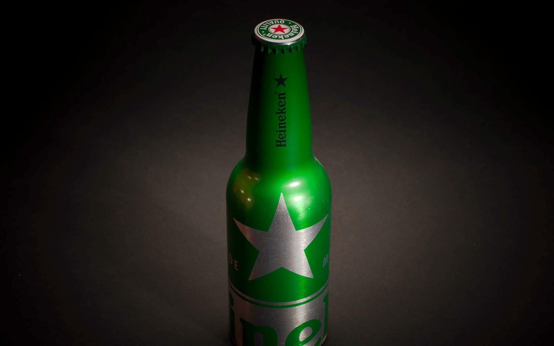green and gray Heineken bottle