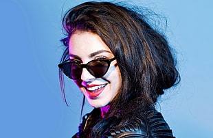 woman wearing black tint sunglasses with black framed