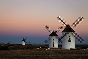 photography of white-and-brown windmills at daytime, cuenca, spain