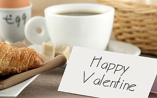 croissant beside cup of coffee with happy valentine card HD wallpaper
