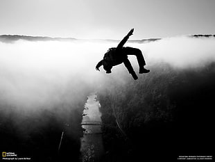 National Geographic show screenshot, jumping, clouds, monochrome, landscape