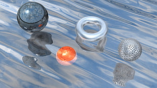 photo of four round objects floating during daytime