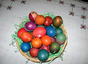 basket of assorted color Easter eggs HD wallpaper
