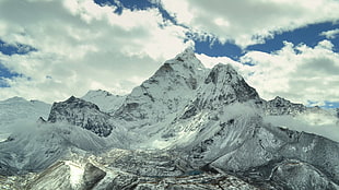 landscape photo of white mountain under white cloudy sky during daytime