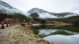 lake near mountain photography during daytime HD wallpaper