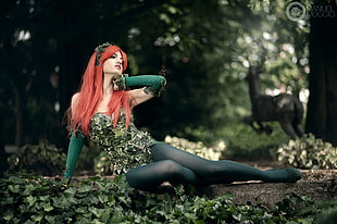 Poison Ivy cosplay sitting on the ground HD wallpaper