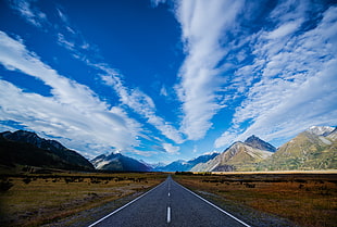 gray road with brown mountains landscape photo
