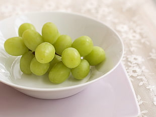white grapes on white ceramic plate