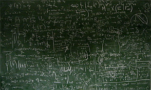 mathematical equations written on chalk board