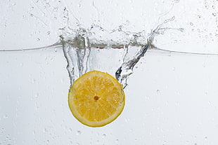 yellow lemon on water HD wallpaper