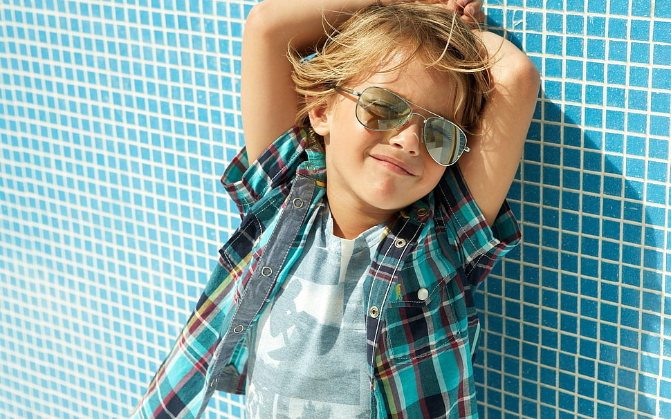 boy in plaid shirt leaning beside wall HD wallpaper