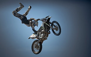 Motocross athlete doing trick mid-air HD wallpaper