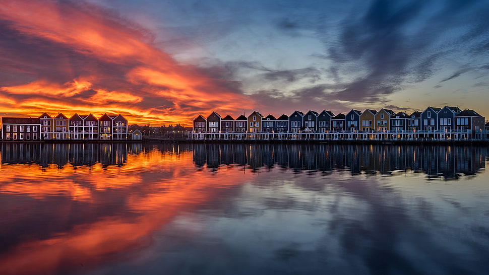 lined up buildings, reflection, sunset, water, Sun HD wallpaper