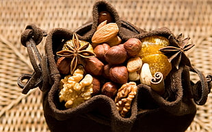 assorted fruit on brown leather bag