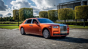orange and gray Rolls Royce Phantom
