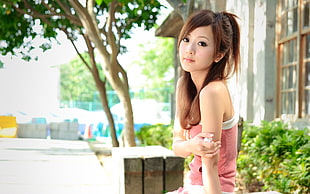 woman in pink and white sleeveless top