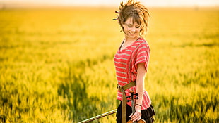 woman wearing pink and white striped shirt carries violin HD wallpaper