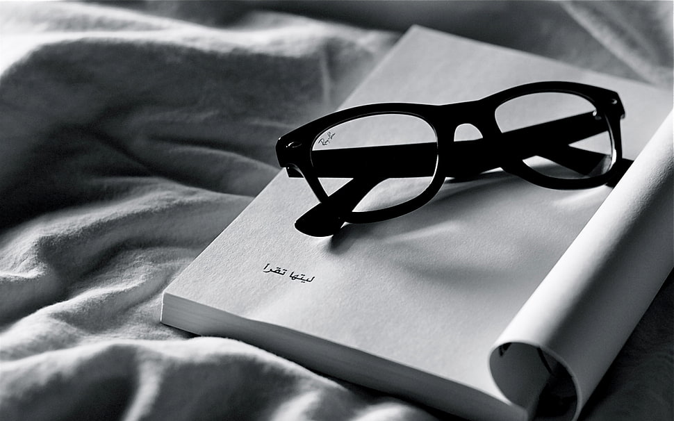 black frame Ray-Ban Wayfarer eyeglasses on book HD wallpaper