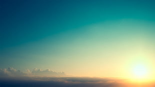 sun on sky with clouds