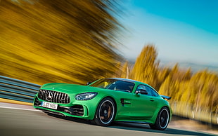 photography of green Mercedes-Benz coupe on asphalt road