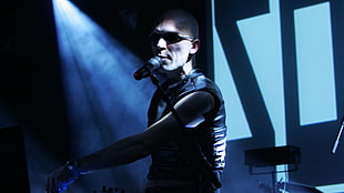 music artist with sunglasses performing