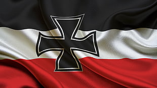 photo of white, red, black Cross print flag