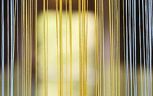 yellow and gray string curtains