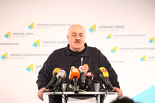 person holding Ukraine Crisis Conference