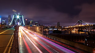 brown concrete bridge, night, lights, long exposure, cityscape HD wallpaper