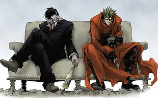 Vash Stampede and man in black suit jacket and tailored pants sitting on sofa