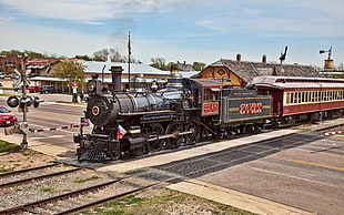 Portrait of black and red vintage train during daytime