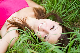 woman laying down on a grassy area HD wallpaper