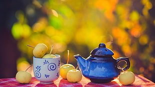 blue ceramic teapot and white and blue ceramic mug, tea, fruit, bokeh, mugs