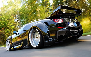 timelapse photography of black Bugatti Veyron