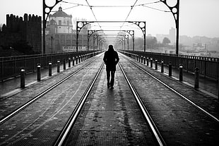 human walking in the middle of railway HD wallpaper