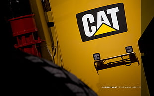 yellow and black DeWalt tool box, Caterpillar, logo