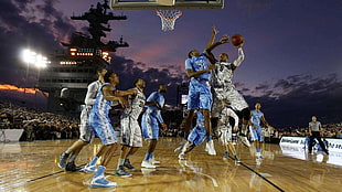 10 men playing basketball during nighttime HD wallpaper