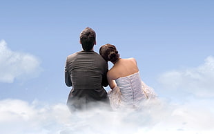 woman leaning on man's shoulder while facing the sky