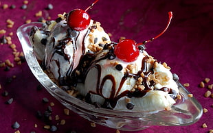 two scoop of ice cream with cherries on top