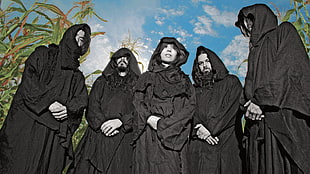 five men with robe under blue sky