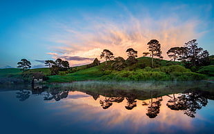 landscape photography of body of water and green plants, New Zealand, landscape, Hobbiton, sunset