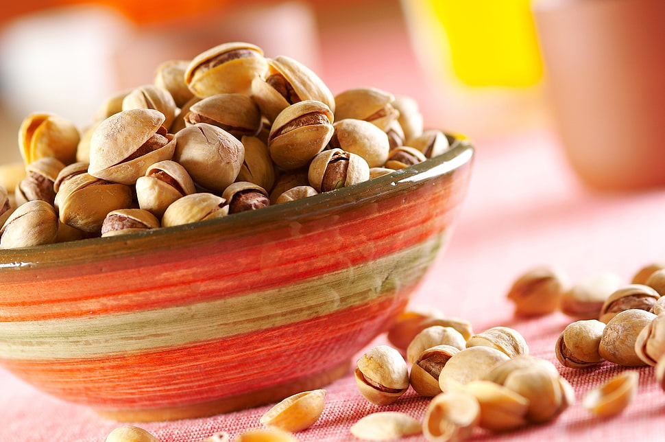 brown peanuts on red ceramic bowl HD wallpaper