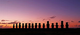 silhouette photo of stone statues