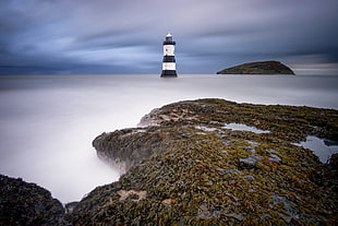 landscape photography of Lighthouse near mountain, penmon HD wallpaper