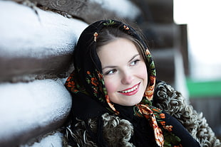 woman wearing black, brown, and green floral traditional dress